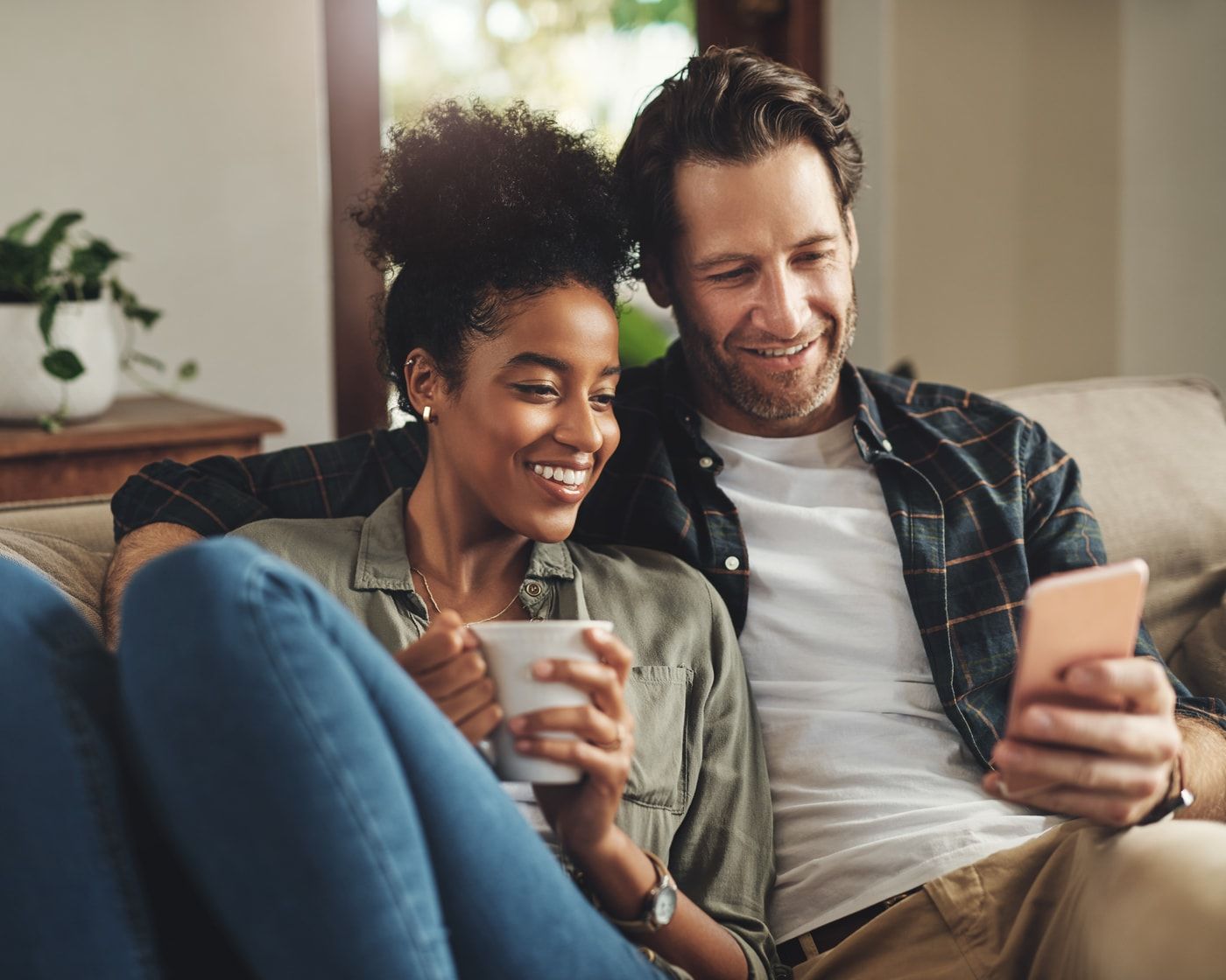 A couple relaxing together on the couch at home, the week’s dinners already sorted.